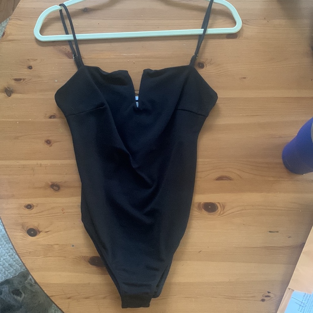 Black body suit, size small. NWT